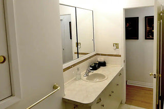 The Spa Oasis is a full bathroom at Cellar House. The full bathroom features a sink, and a two-panel mirror.
