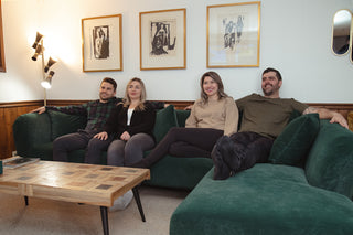 Friends relaxing and binge-watching on the sectional sofa and 55" Samsung SmartTV in the cozy downstairs living room.